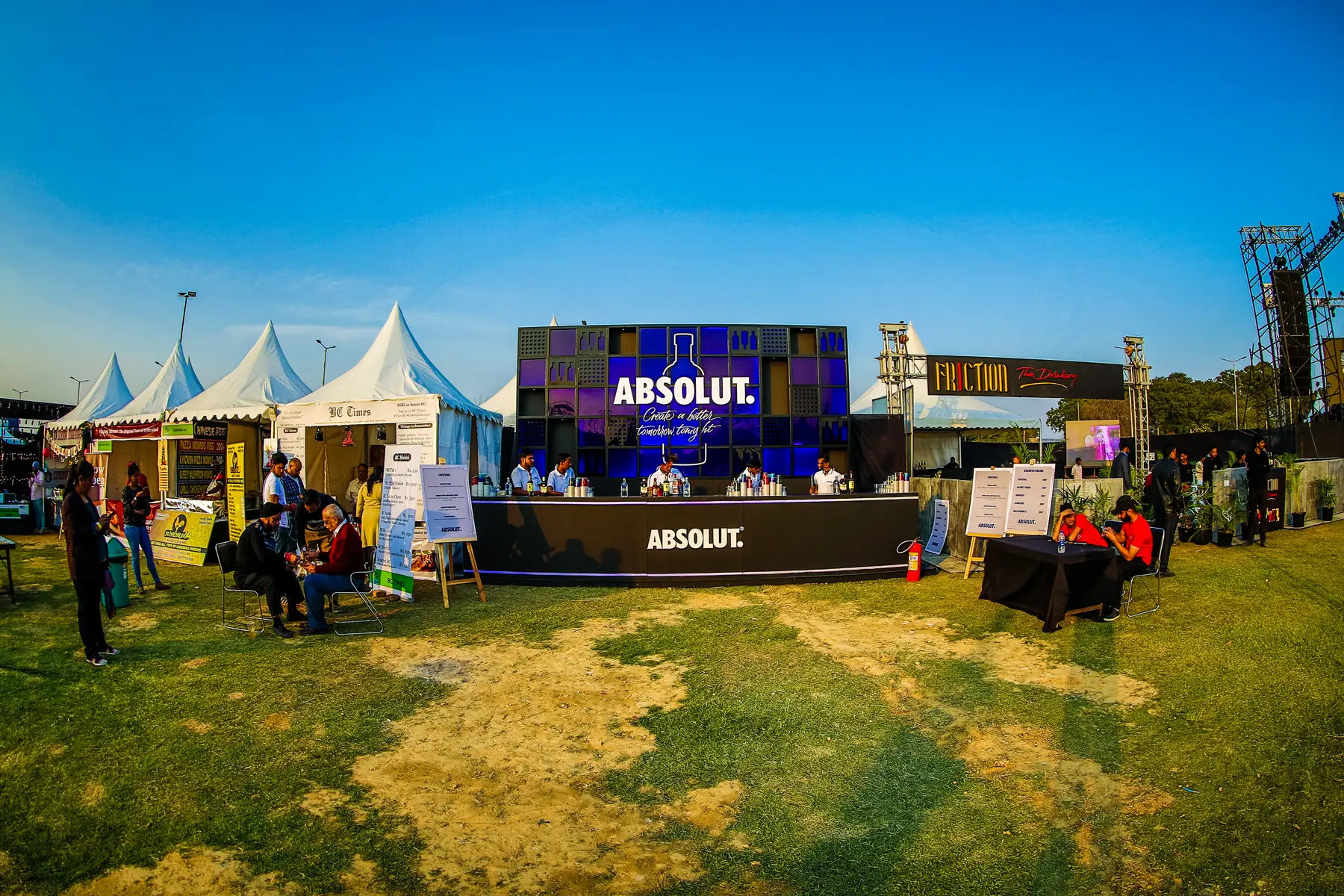 The Absolut bar on the lawn under a blue sky